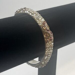 jeweled bangle bracelet adorned with multiple colored rhinestones. Size 7 1/4